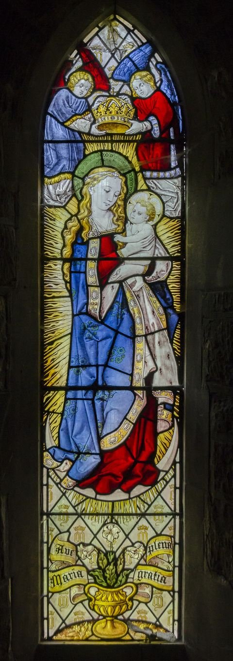 The tall stained glass window in the west tower of St Peter and St Paul, Caistor
